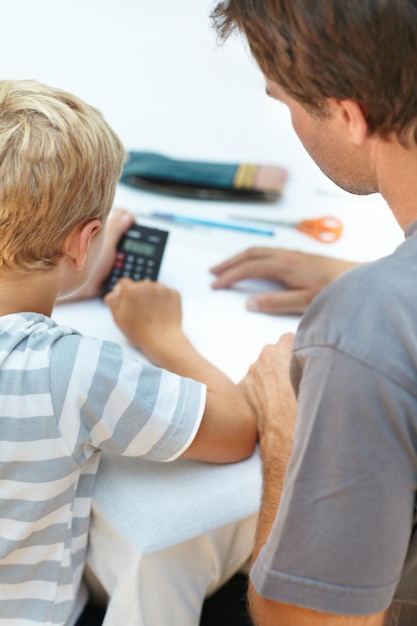 A close-up shot of tax forms with a calculator and documents related to child expenses, emphasizing the importance of accurate documentation when claiming the Child Tax Credit.